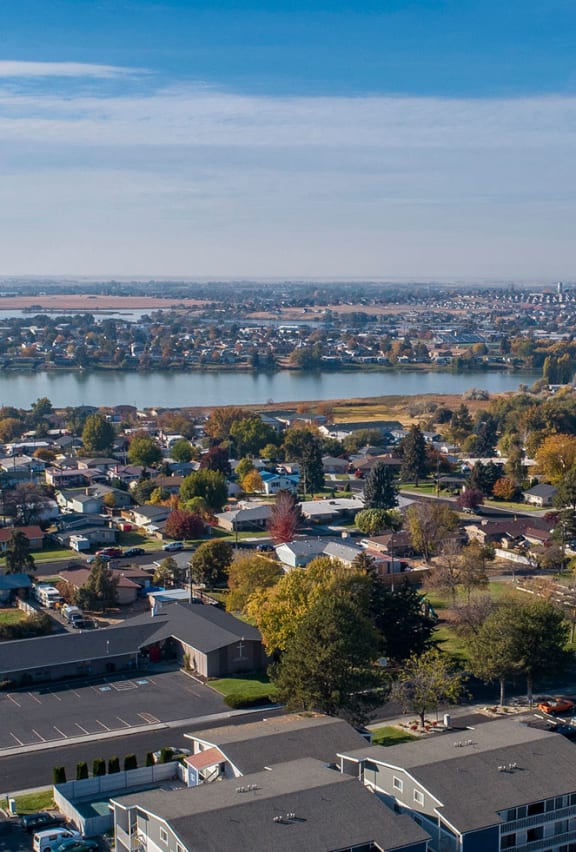 a aerial view of a community with houses and trees at The Lakes Apartments, Moses Lake, WA