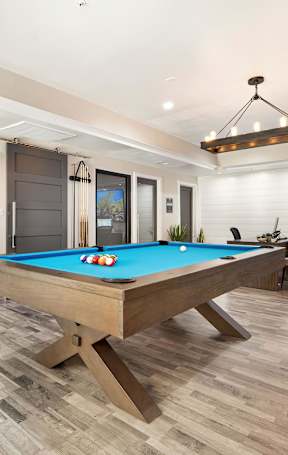 the pool table in the clubhouse at the preserve at great pond apartments in windsor
