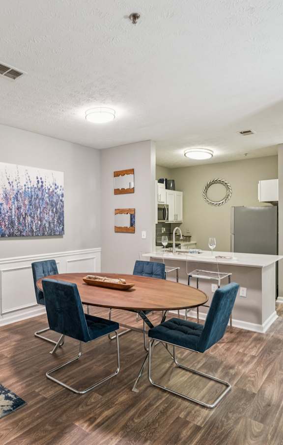 A kitchen with white appliances and cabinets.at The Atlantic Canton Ridge, Georgia, 30114