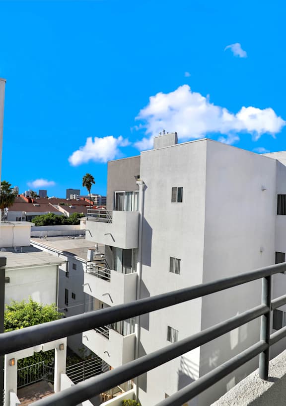 A gym with a variety of equipment including treadmills, weights, and exercise machines at Midvale Towers Apartments Westwood, California 90024