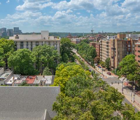 the view of the city from the roof of a building