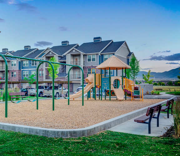 a playground at the flats at big tex apartments in san antonio, tx