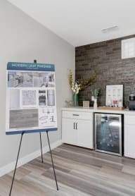the preserve at ballantyne commons community room with counter and refrigerator and bulletin board at Sunnymead Apts Apartments, Moreno Valley, California