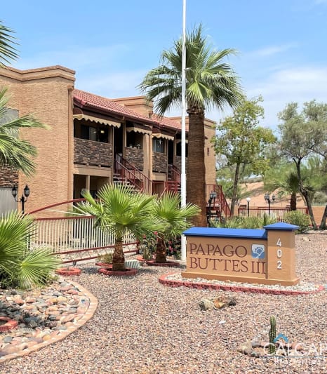 a building with palm trees in front of it