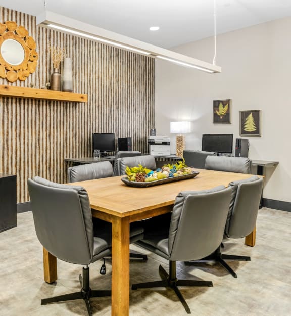 a dining room with a table and chairs