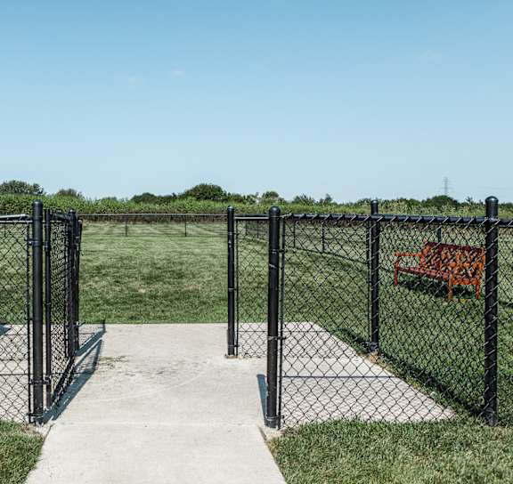 the entrance to the pet park through a chain link fence at Brickshire Apartments, Merrillville, Indiana, 46410