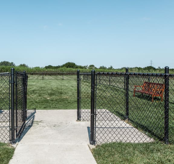 the entrance to the pet park through a chain link fence at Brickshire Apartments, Merrillville, Indiana, 46410