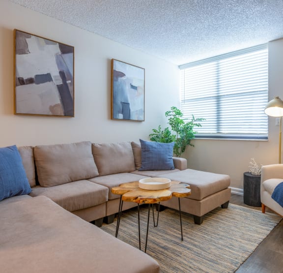 a living room with a couch chair and coffee table  at Club at Emerald Waters, Hollywood, 33021