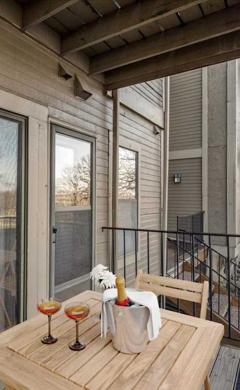 a dining room and kitchen with a glass table and chairs