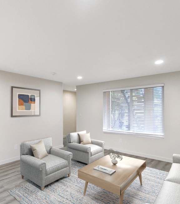 A living room with a couch, a coffee table, and a side table.