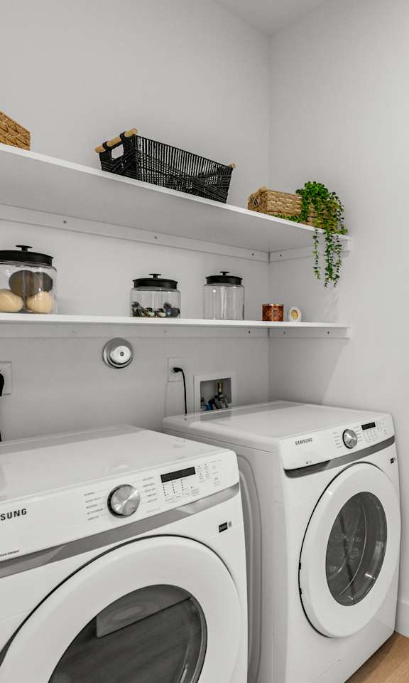 A laundry room with a washer and dryer.