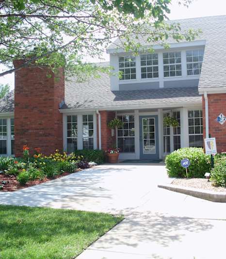 Front view of the Northpark Apartments clubhouse with well-kept landscaping.