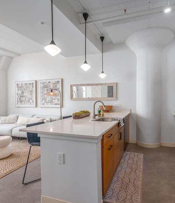 Kitchen with attached living room at Life At Agora Apartments, Cleveland, Ohio