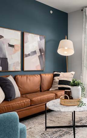 a living room and dining room with a couch and a table