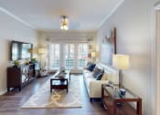 Thumbnail 7 of 33 - a living room filled with furniture and a large window  at The Preserve at Tampa Palms, Tampa, Florida
