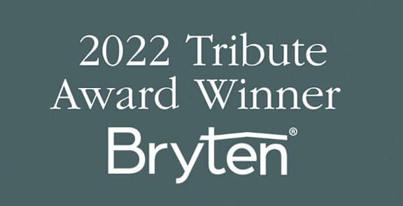 A dark green background with the text "2022 Tribute Award Winner Bryten" displayed in white.