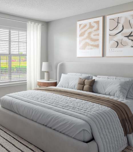 a bedroom with a large bed and a window at Riverset Apartments, Memphis, 38103