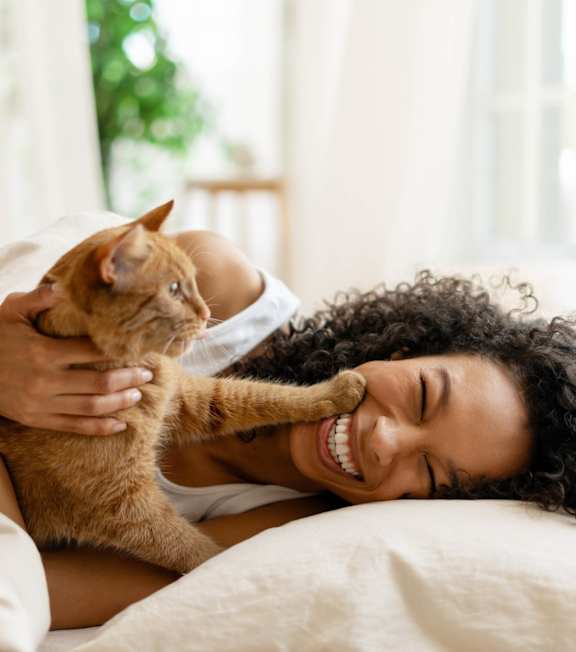 Woman Playing with Cat at Enclave at Wolfchase in Cordova, TN