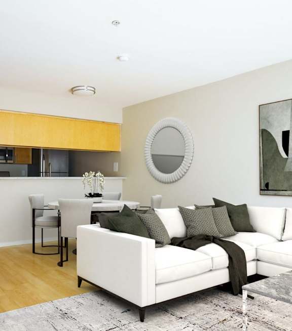 a living room and dining room with white furniture