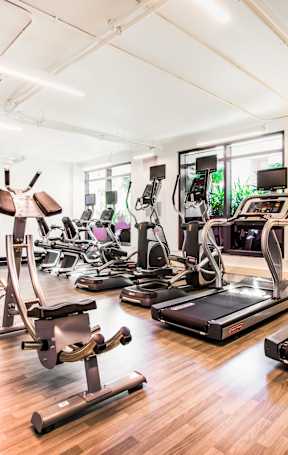 A gym with treadmills, exercise bikes, and other equipment.at The Rise, San Francisco, CA