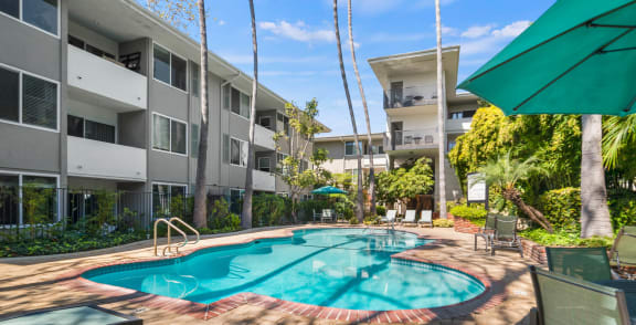 a large swimming pool in front of an apartment building  at Sunset Barrington Gardens, Los Angeles, CA, 90049
