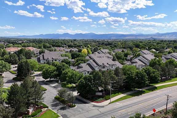 an aerial view of a neighborhood with rows of houses