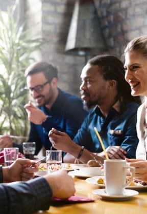 people sitting around a table in a restaurant at Gateway Club, Florida, 33436
