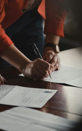 People signing papers at Dillard Apartments in Fargo, ND 58102