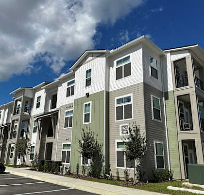 a row of apartment buildings on a city street