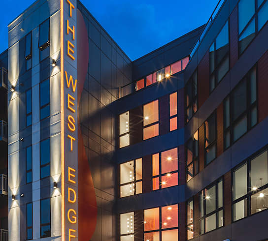 an exterior view of a building at night