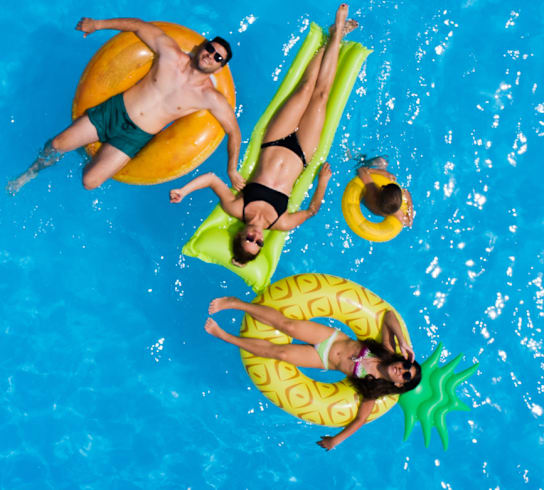 Pool and residents at Quarry Apartments and Townhomes in DeWitt, Michigan