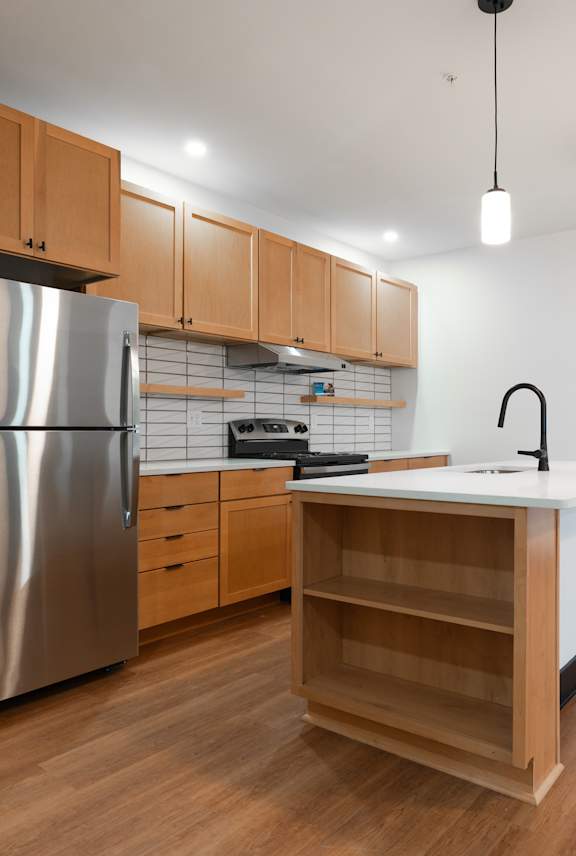 Kitchen with stainless steel appliances at The Yard Apartments, Louisville, KY, 40202