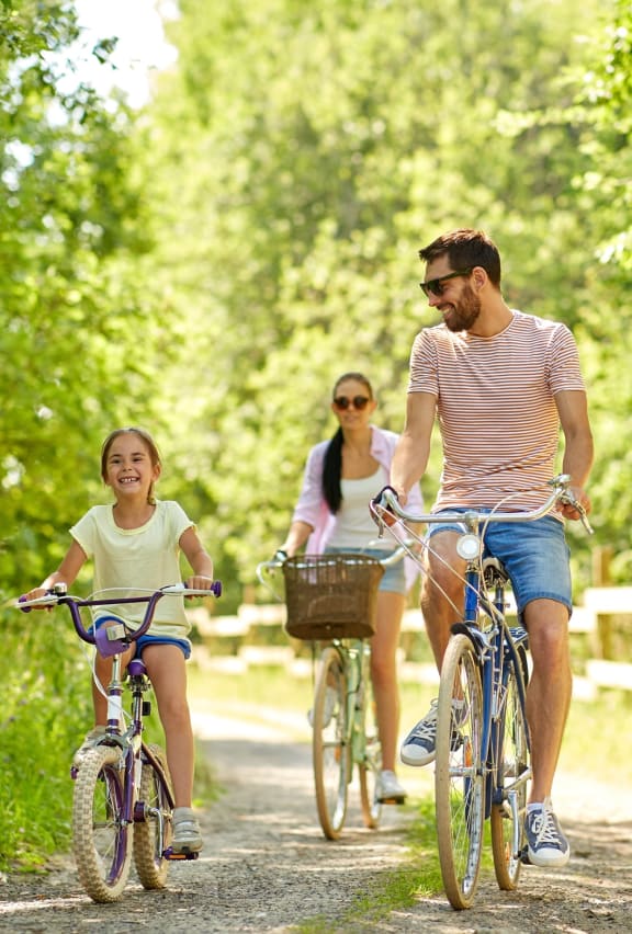 family biking in park at Copper Pines, Bozeman, MT, 59718
