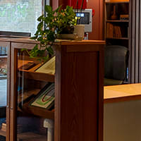 a lobby with a reception desk and a door to a library