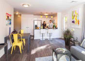 Thumbnail 2 of 24 - Open-concept kitchen and living area with stylish pendant lighting
