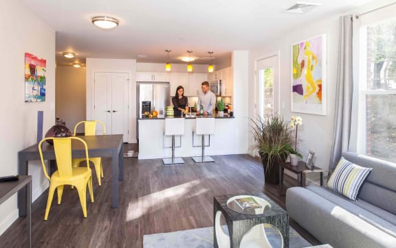 Open-concept kitchen and living area with stylish pendant lighting