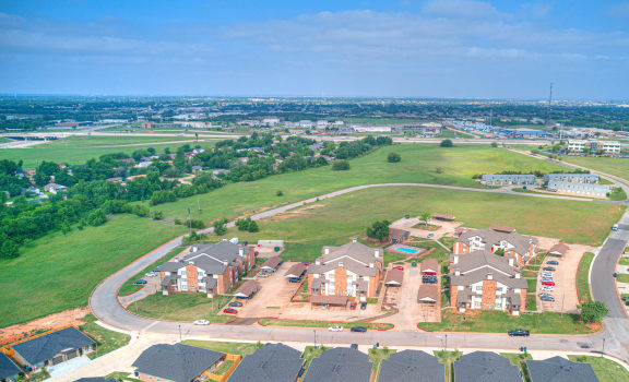 an aerial view of a neighborhood with houses and an airport