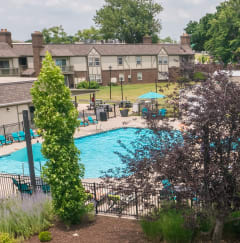 an aerial view of a yard with a swimming pool