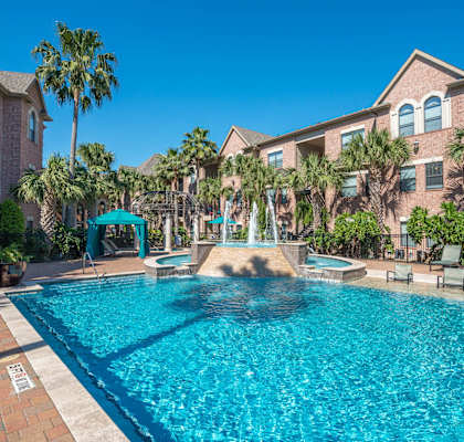 swimming pool at apartment community in Houston offering essential and workforce housing