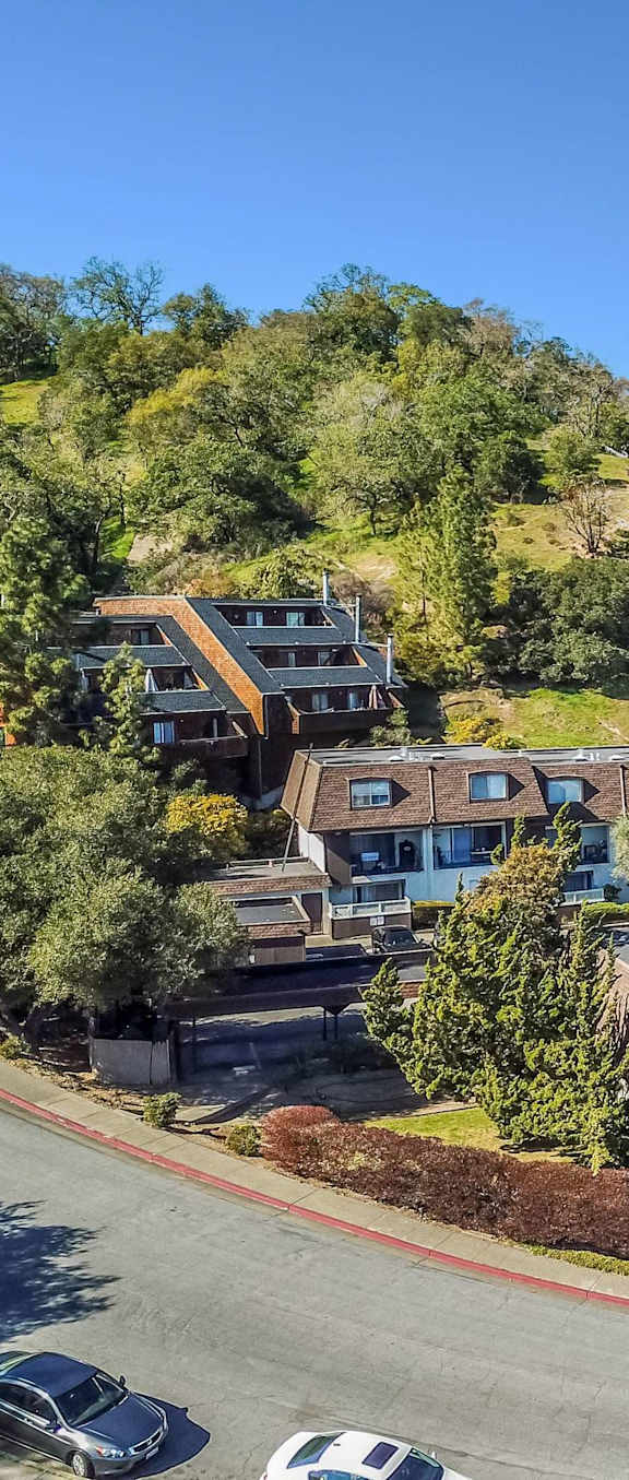 aerial view of apartment buildings and hillside at Posada East Apartments, California, 94949