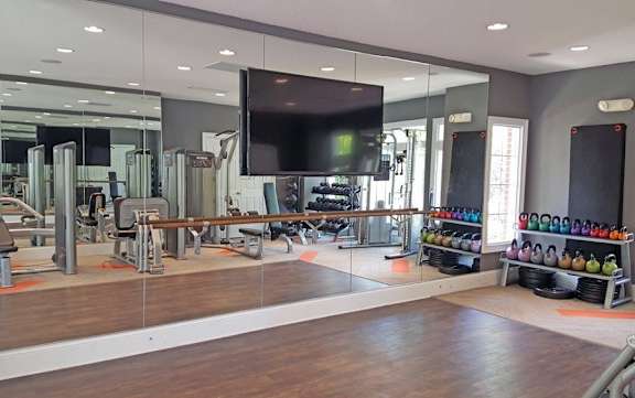 Fitness center with virtual training and barre bar