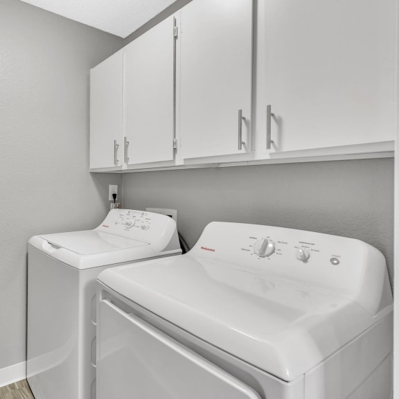 a bedroom with a large bed and a bathroom