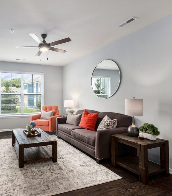 a bedroom with a bed and a ceiling fan