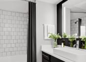 Thumbnail 10 of 20 - a bathroom with a sink and a shower and a bath tub