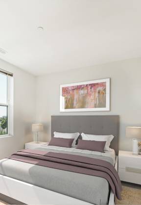 a bedroom with a bed and two night stands with lamps at The Merc, Waltham, MA, 02453