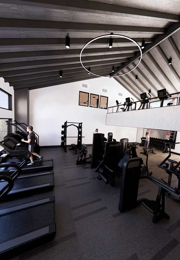 a gym with cardio equipment and a flat screen tv at Promontory, Tucson