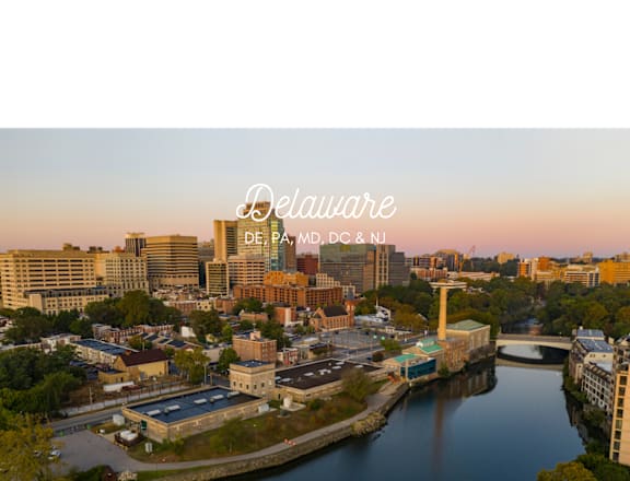 an aerial view of the city at sunset