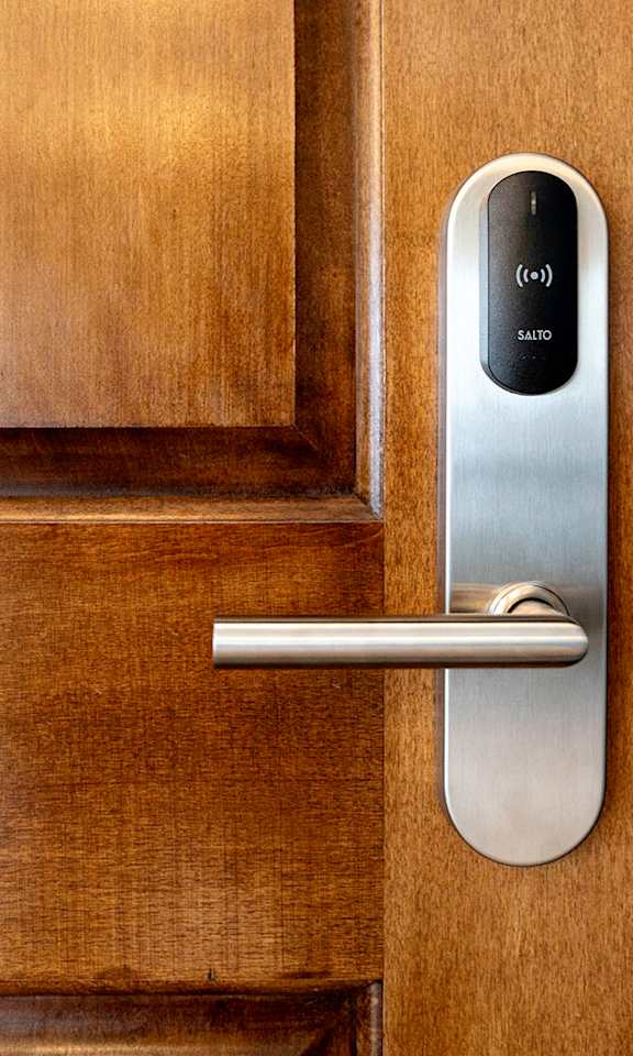 A modern door handle with a digital lock.