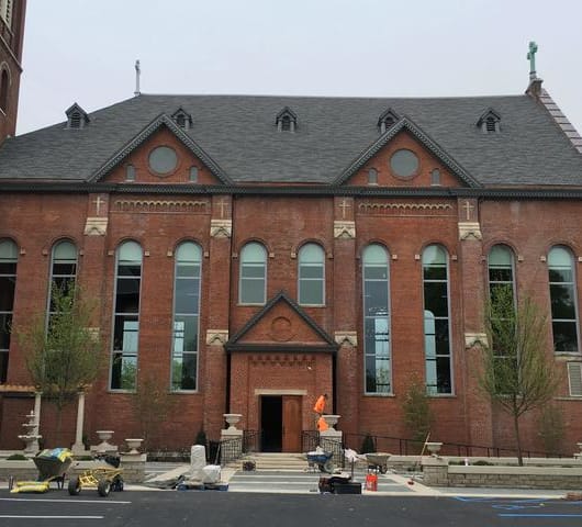a large brick building with a clock tower