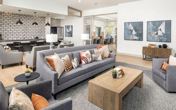 a living room with couches and a coffee table at Fairview Springs in Covington, GA, 30016